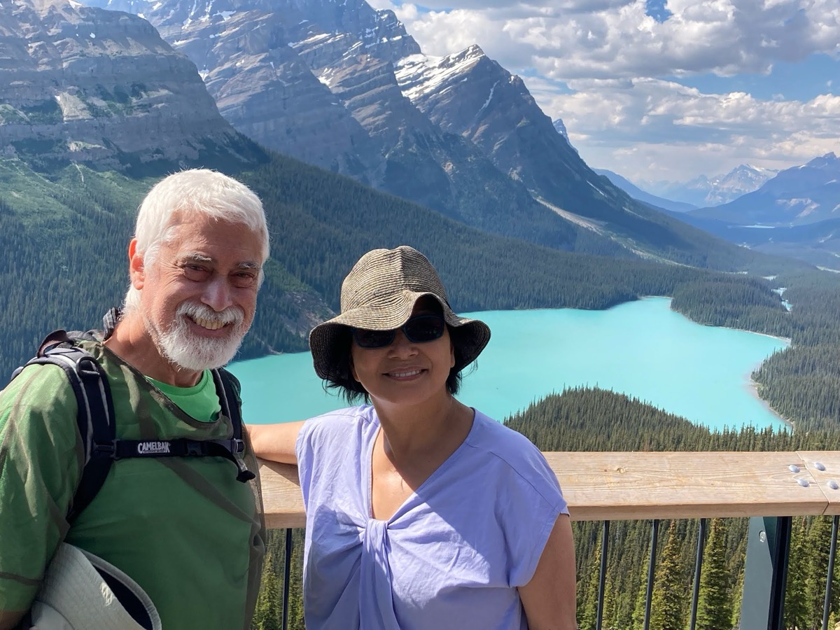 Terry and her friend Josh above a glacier lake in the Canadian Rockies